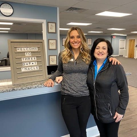 carlie and gina with welcome sign