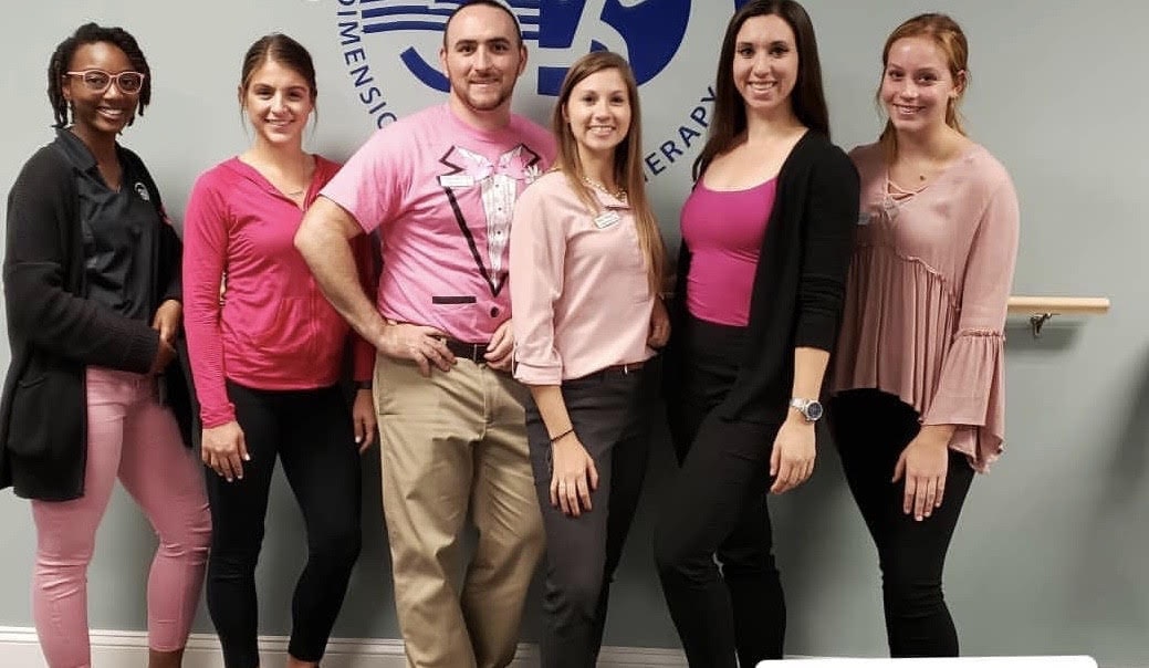 Jess with the 3DPT Haddon Township team, all wearing Pink for Breast Cancer Awareness month