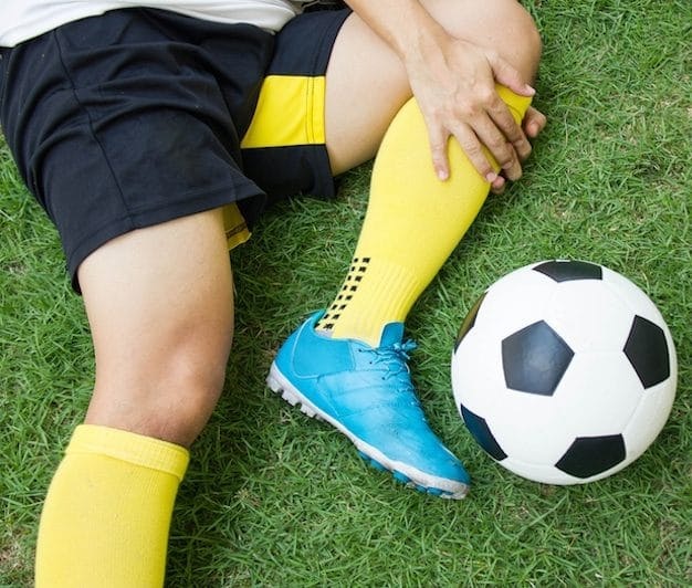 Close-up Of Injured Football Player On Field.