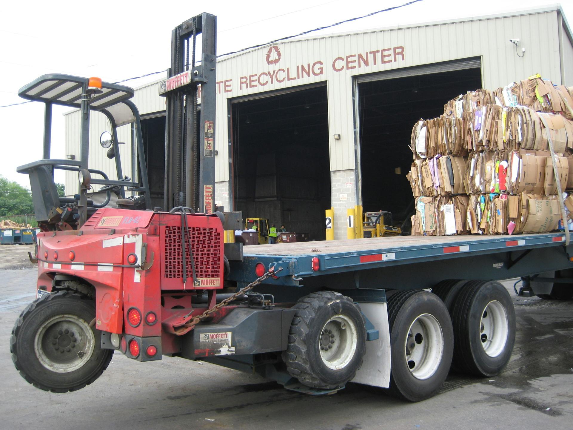 Cardboard bale recycling truck