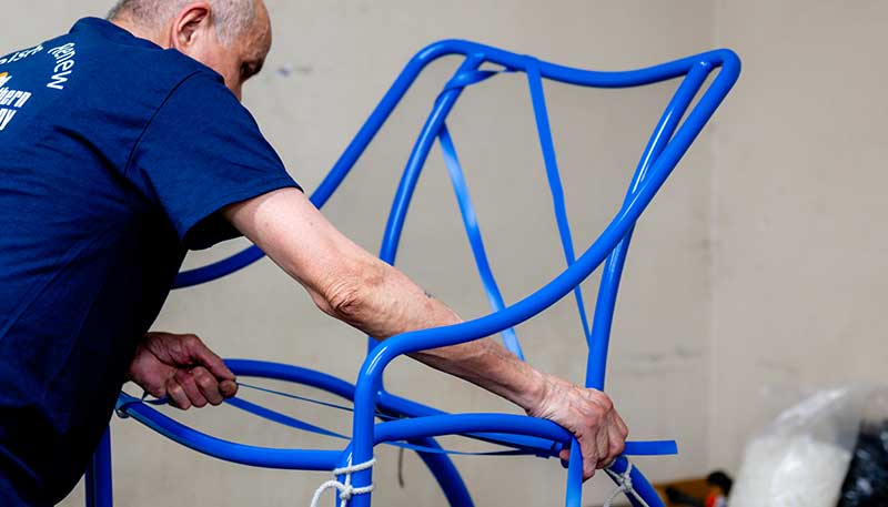 repairing blue sling chair