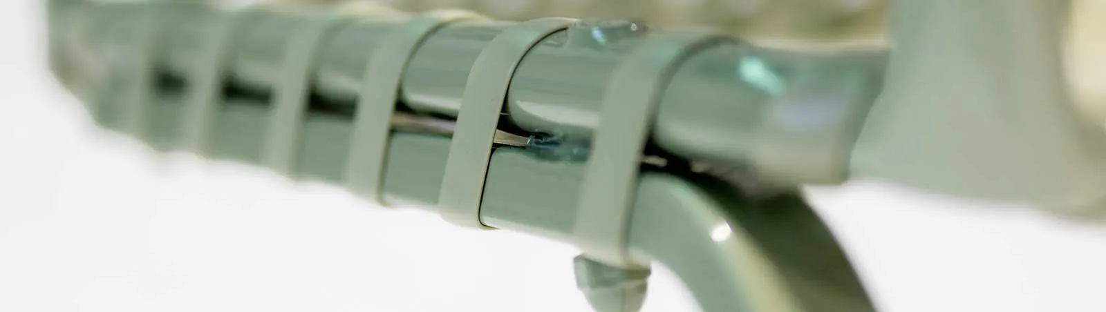 close up of a sage strapped chair