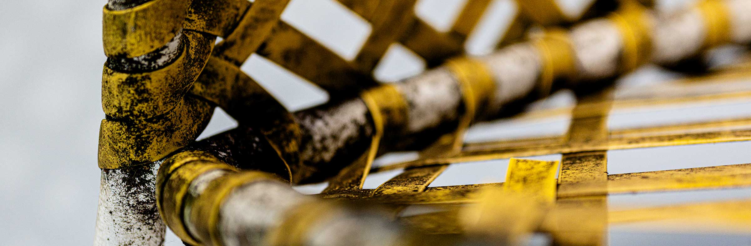 Close-up of yellow strapping on a chair frame being refinished