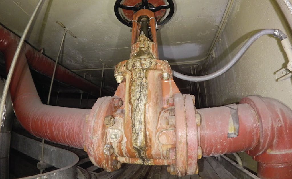 An image captured with a drone reveals a closeup view of pipe leakage at a power plant during an inspection.