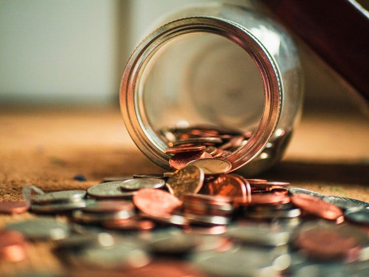 Jar of coins tipped over