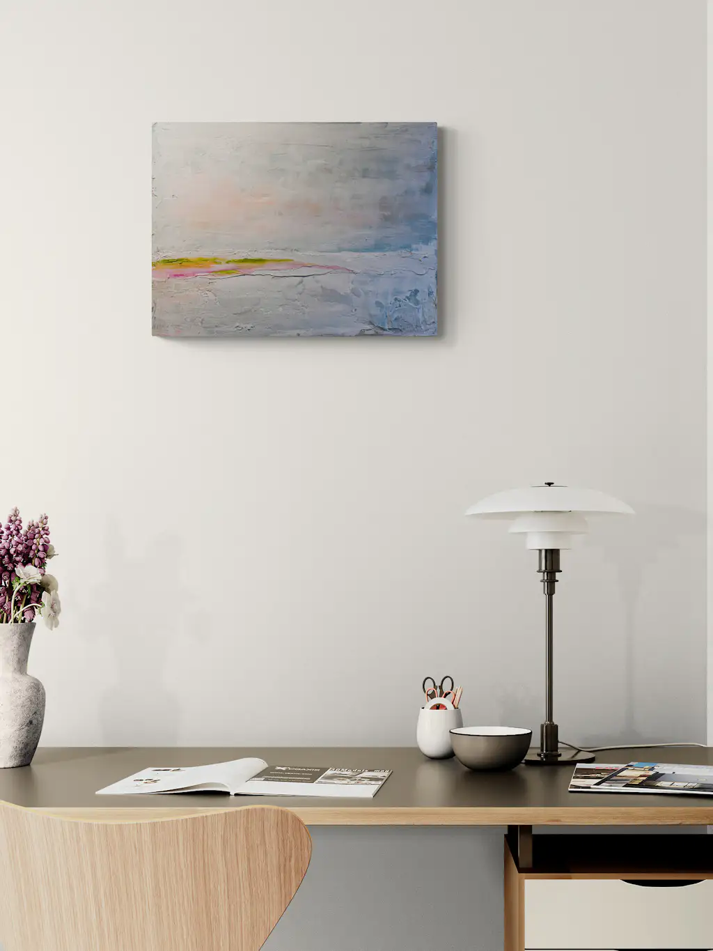 Painting by mandy morroni hung on a wall in a room.