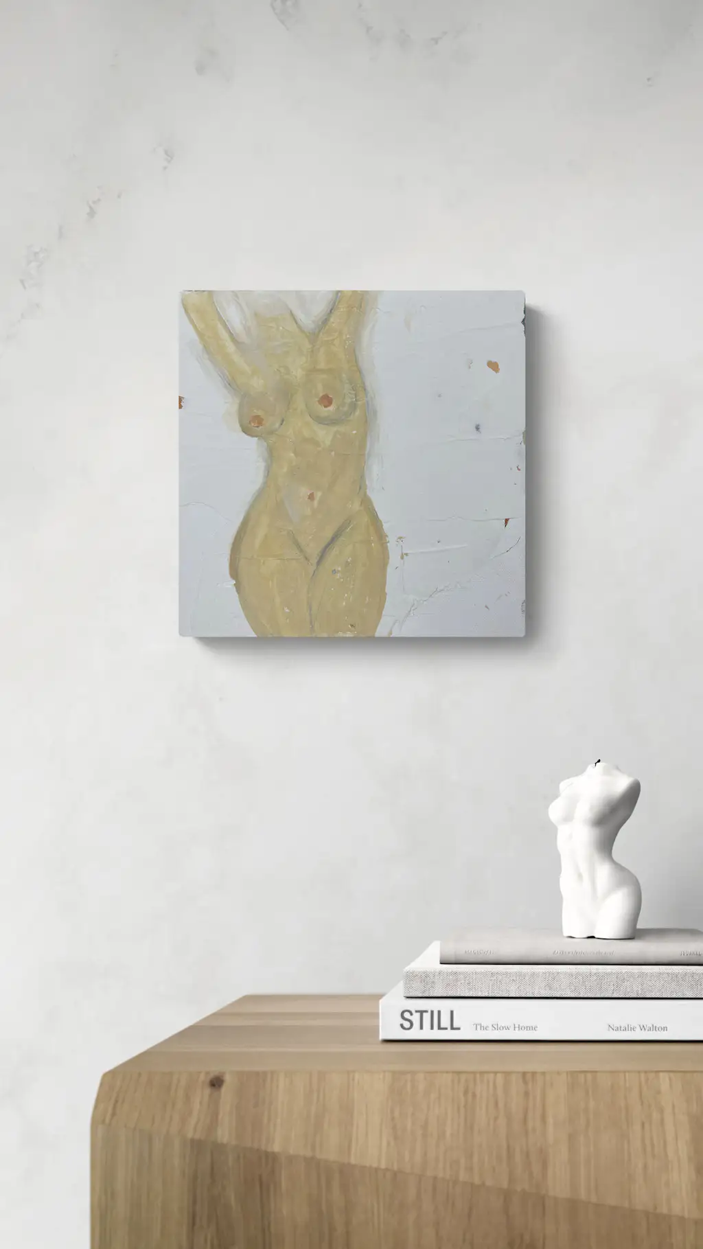 Painting by mandy morroni hung on a wall in a room.