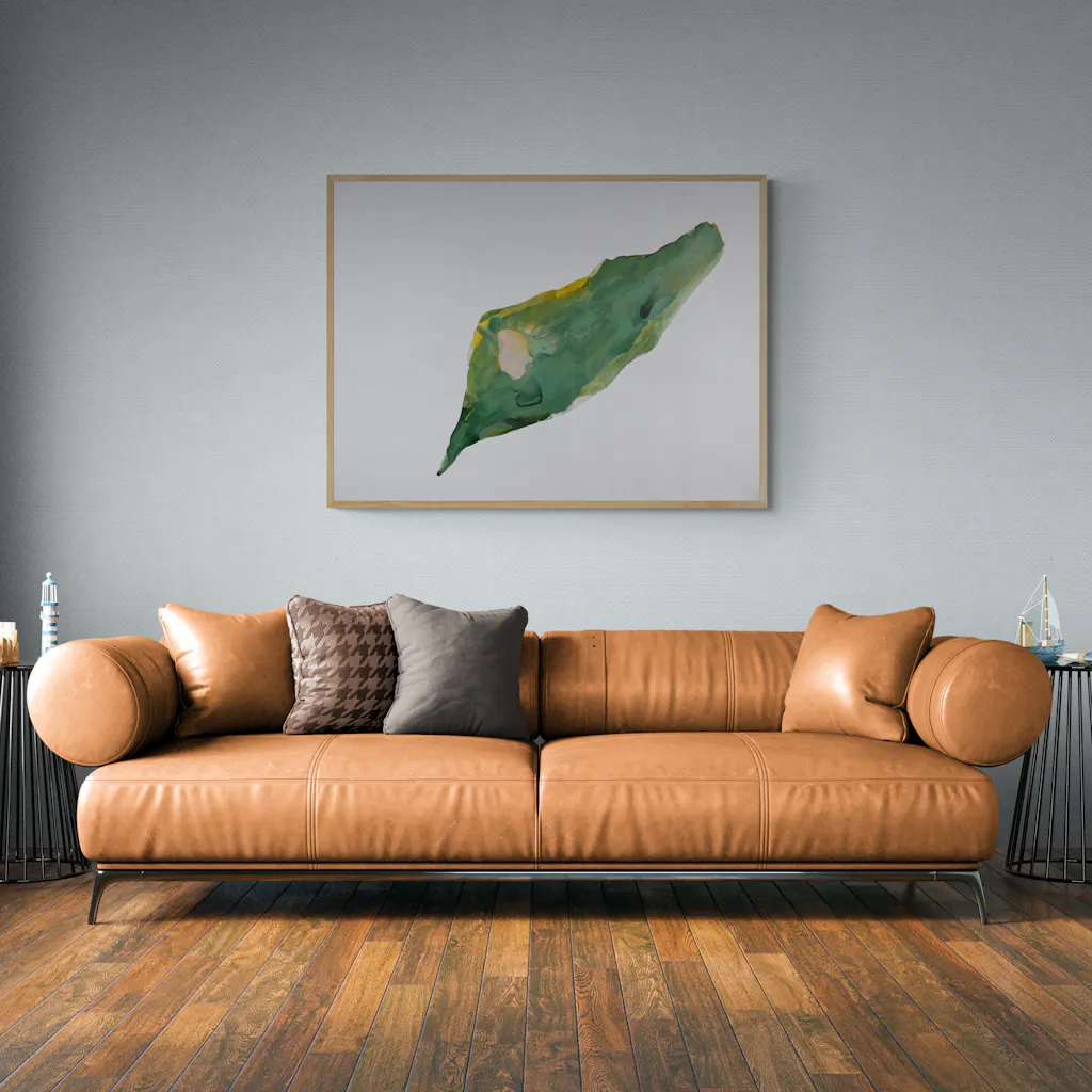 Painting 'triggered-22' being hung on a wall of a living by a brown sofa.