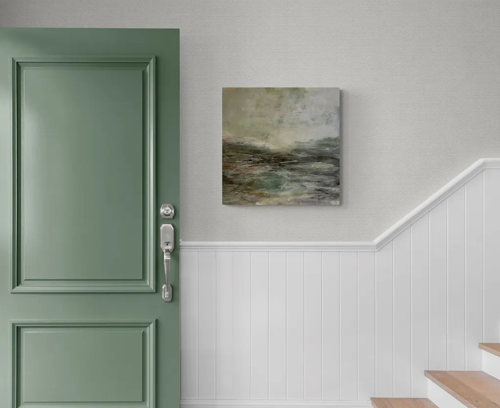 Painting by mandy morroni hung on a wall in a room.