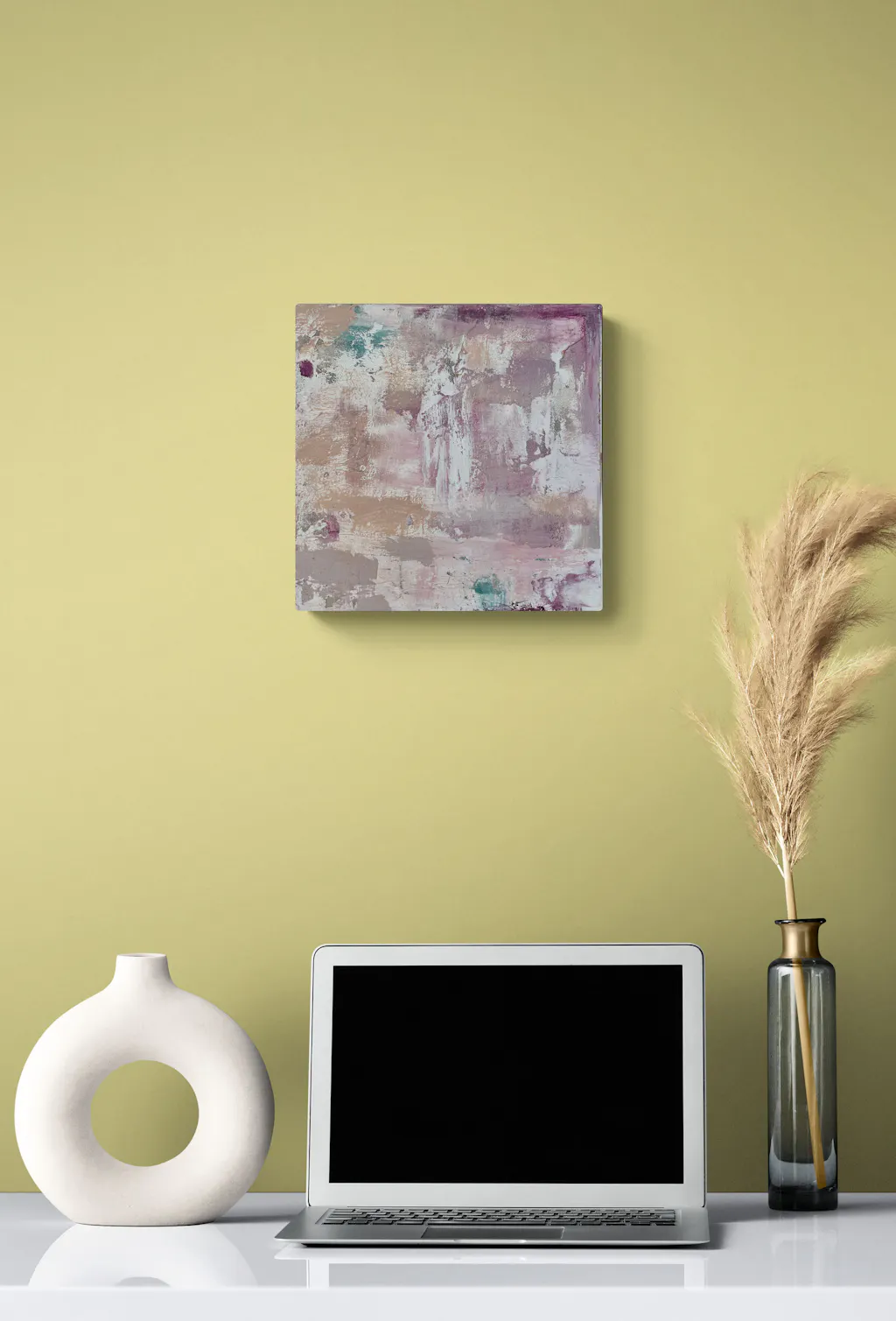 Painting by mandy morroni hung on a wall in a room.