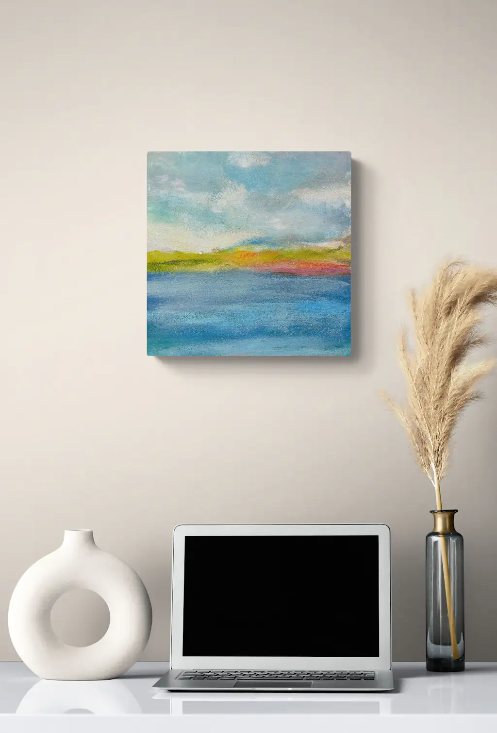 Painting by mandy morroni hung on a wall in a room.