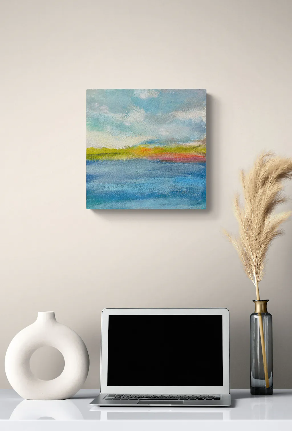 Painting by mandy morroni hung on a wall in a room.
