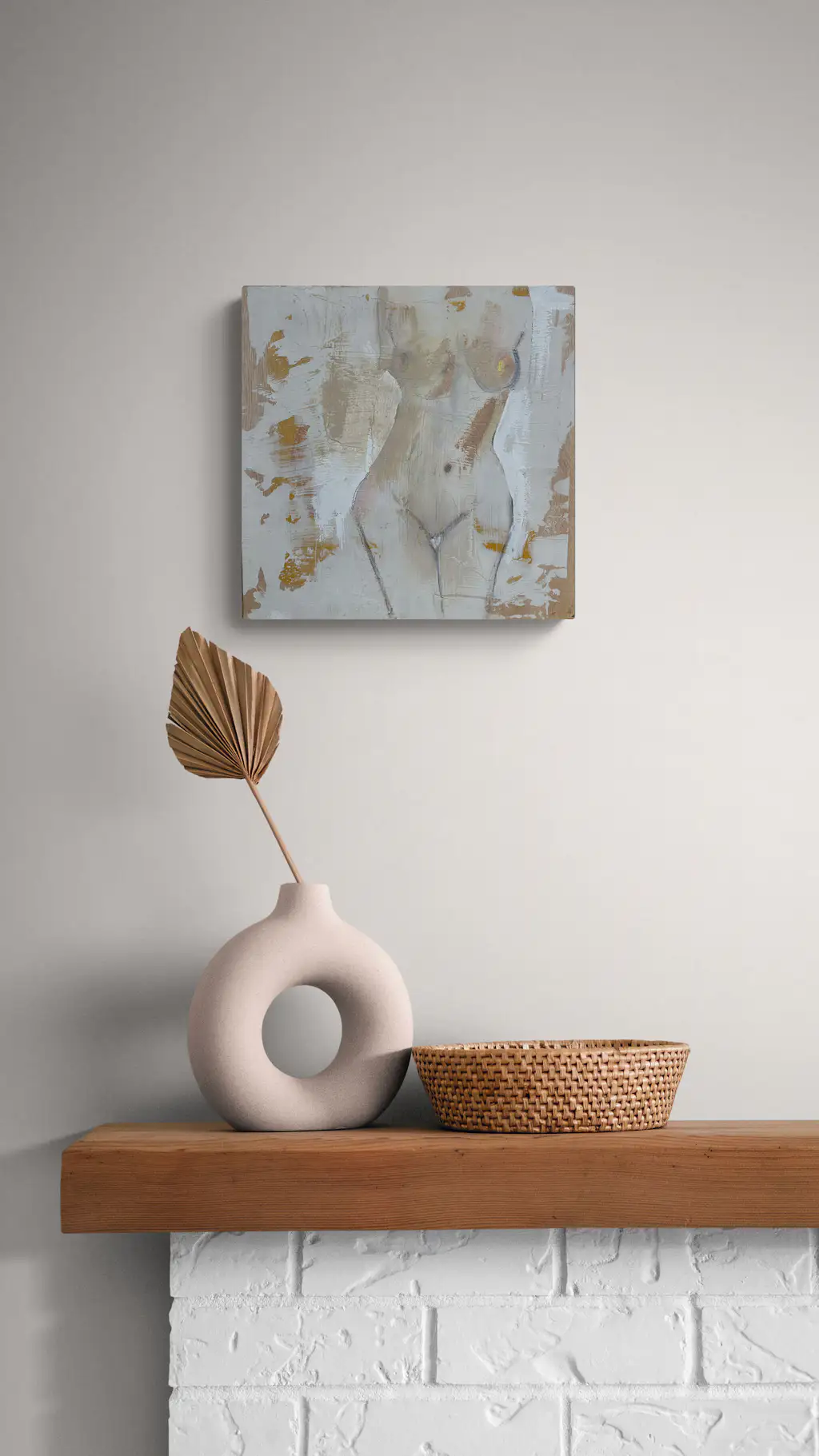 Painting by mandy morroni hung on a wall in a room.