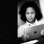 Female Student on iPad – Black & White