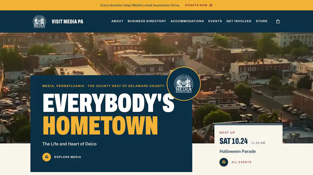 The VisitMediaPA home page after the rebuild — large sans headline over an aerial photograph of Media, with the next event surfaced alongside