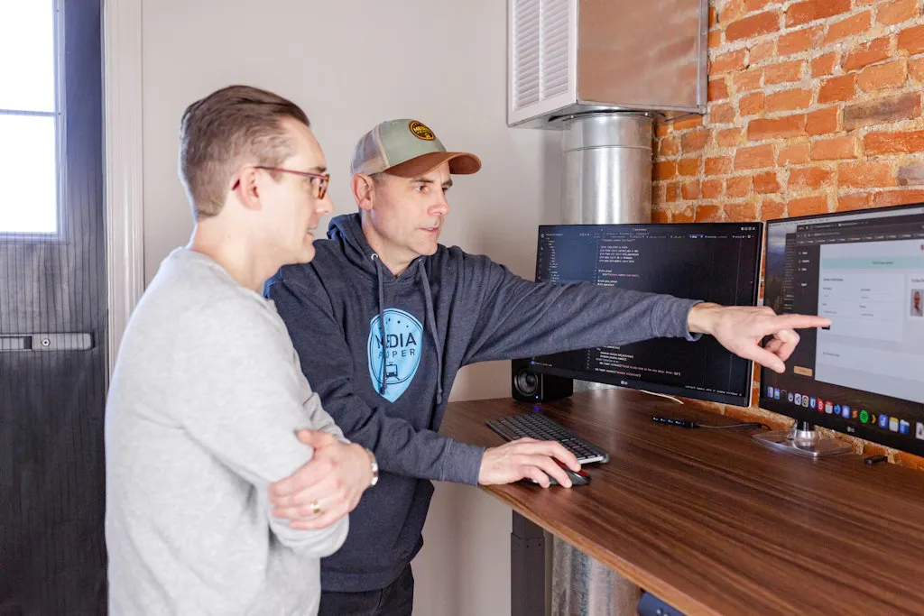 Developers reviewing code together
