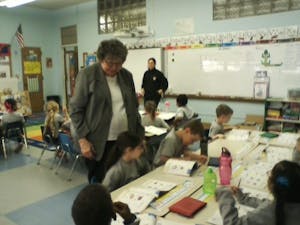 Sr. Connie is at hand if the children have a question about their workbook assignments.