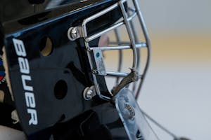 Ice hockey helmet with a face cage
