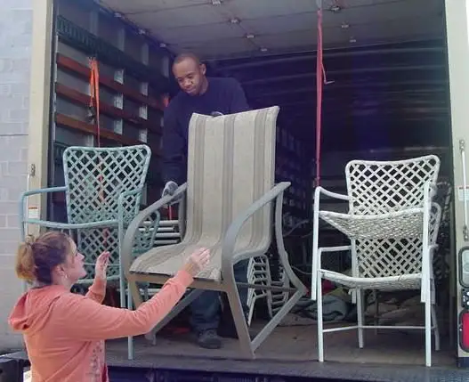 The Southern Company crew unloading restored patio chairs from a delivery truck