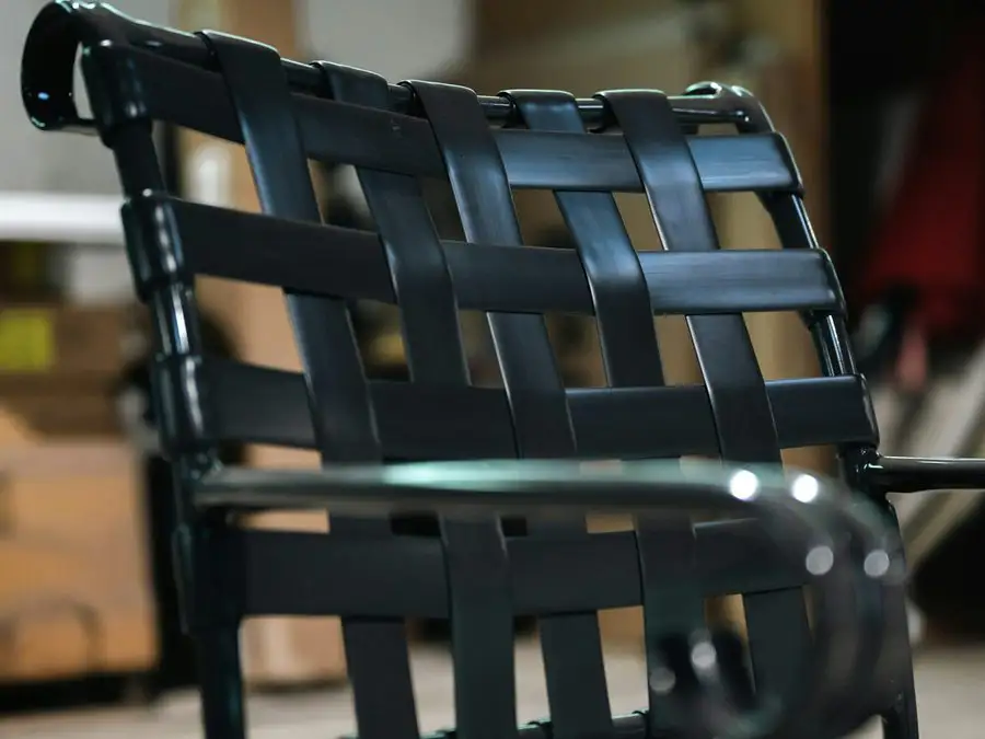 Close view of a restored chair frame with freshly installed fabric