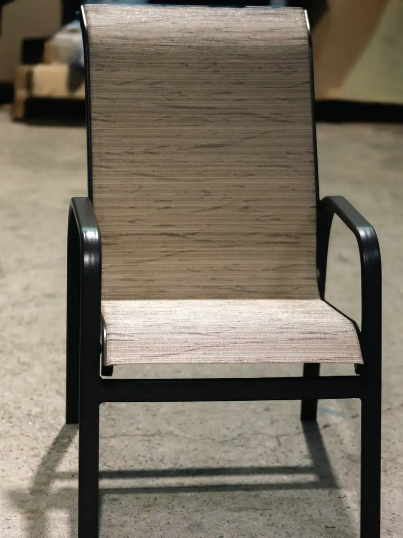 The same patio chair after sling replacement, fitted with a crisp new sling