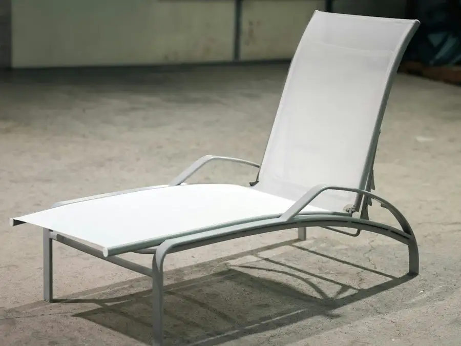 Restored chaise lounge with a crisp white sling