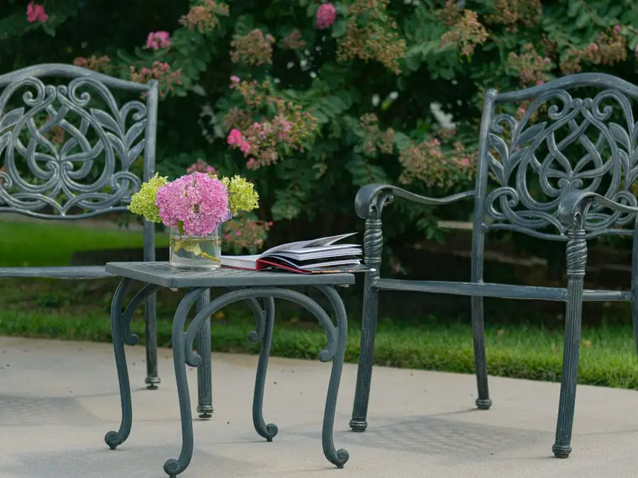 A restored table and chairs set up in a garden